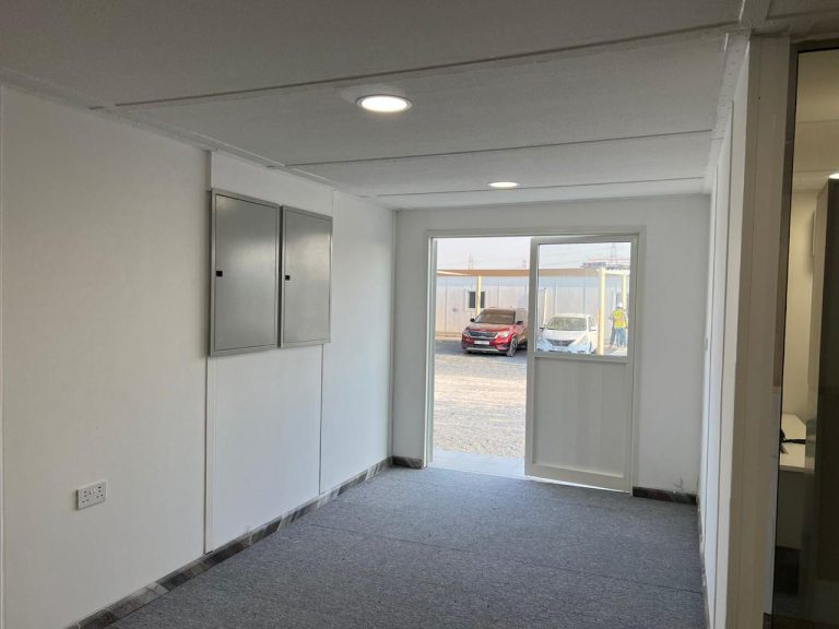 Office cabin interior with glass door and carpet