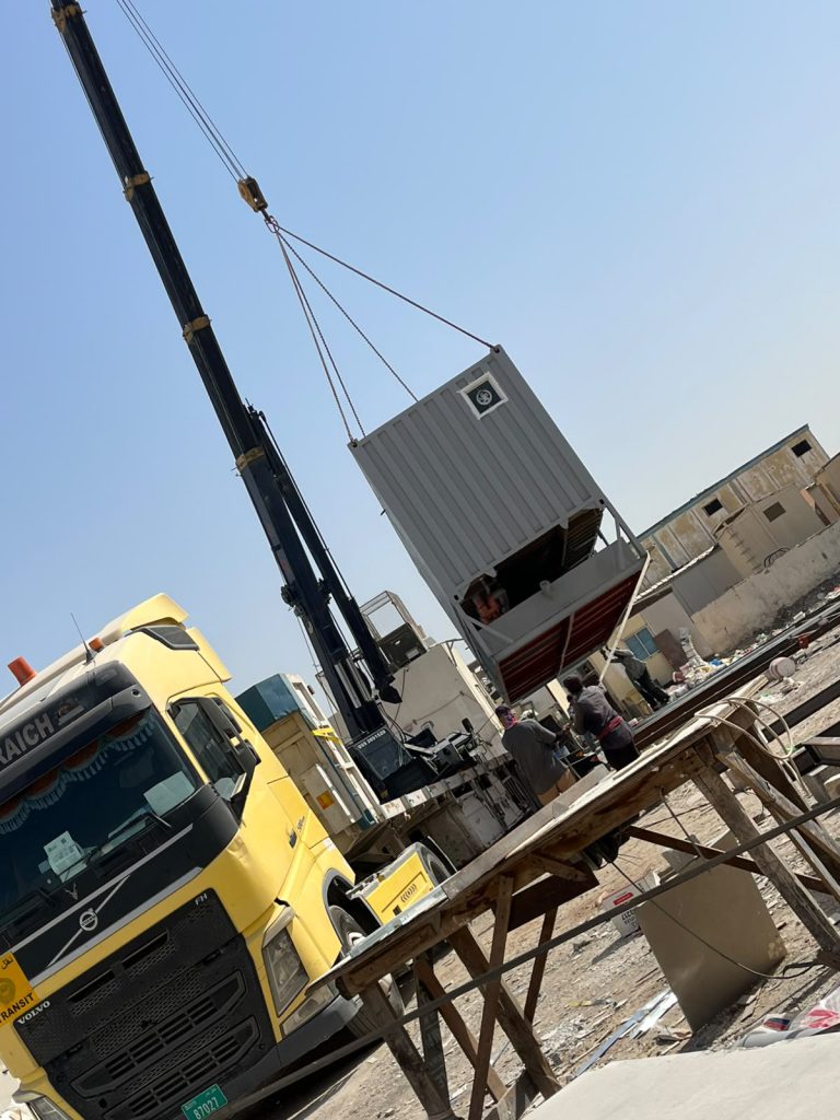 Crane placing a container building module